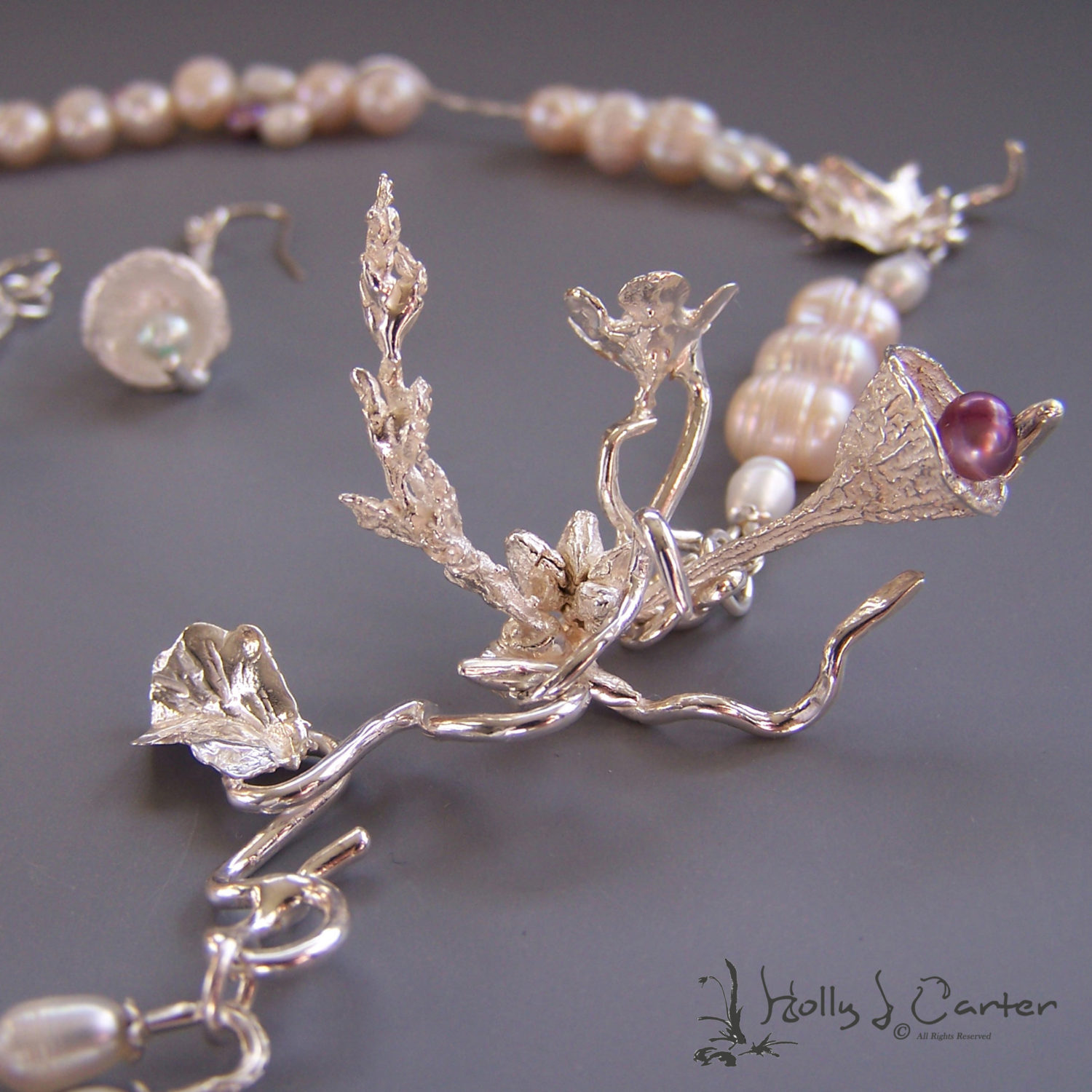 Ethereal Bouquet Necklace and Earrings Set handcrafted by metals artist Holly J. Carter is a stunning and elegant cascade of pearls and sterling organics.