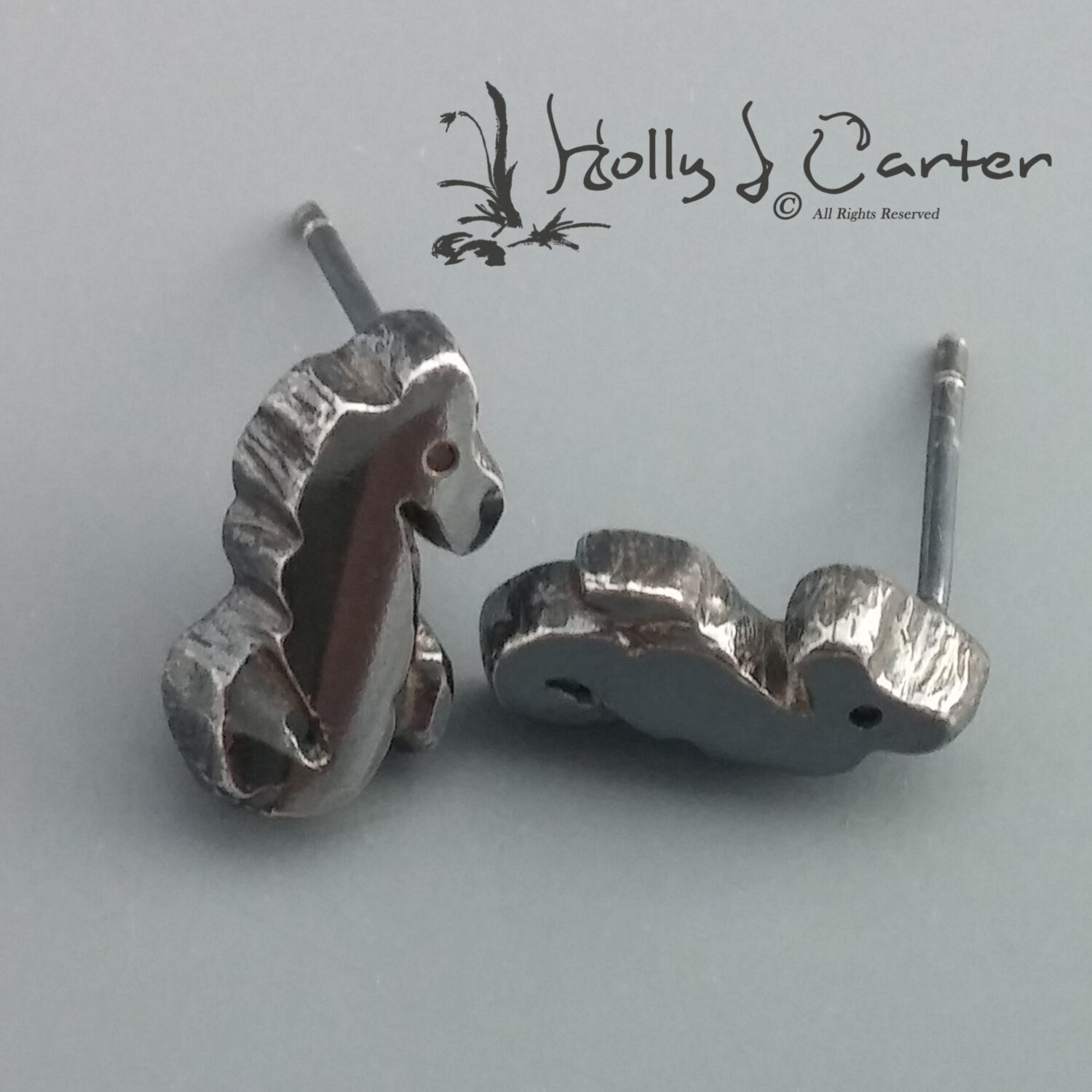 Seahorse Sterling Silver Stud Earrings handcrafted by metals artist Holly J Carter.